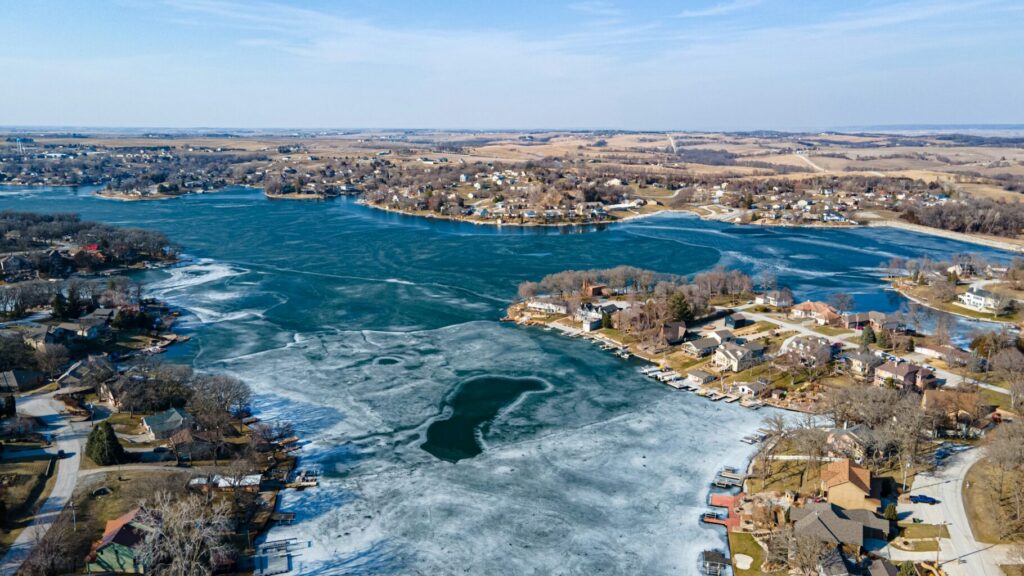 Aerial view of a city near a body of water during daytime.