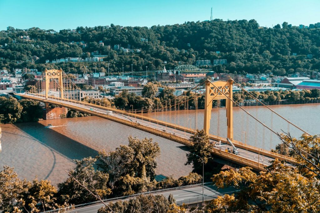 Image of suspension bridge across river in the daytime