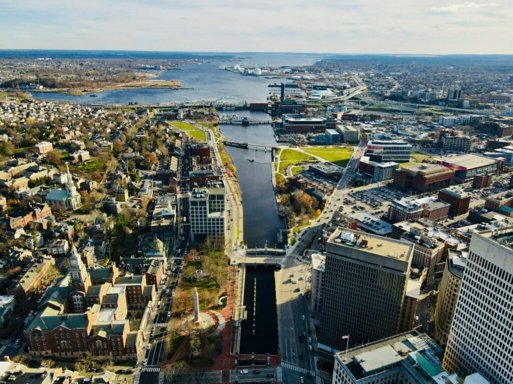 Aerial shot of a city with a river running through it.