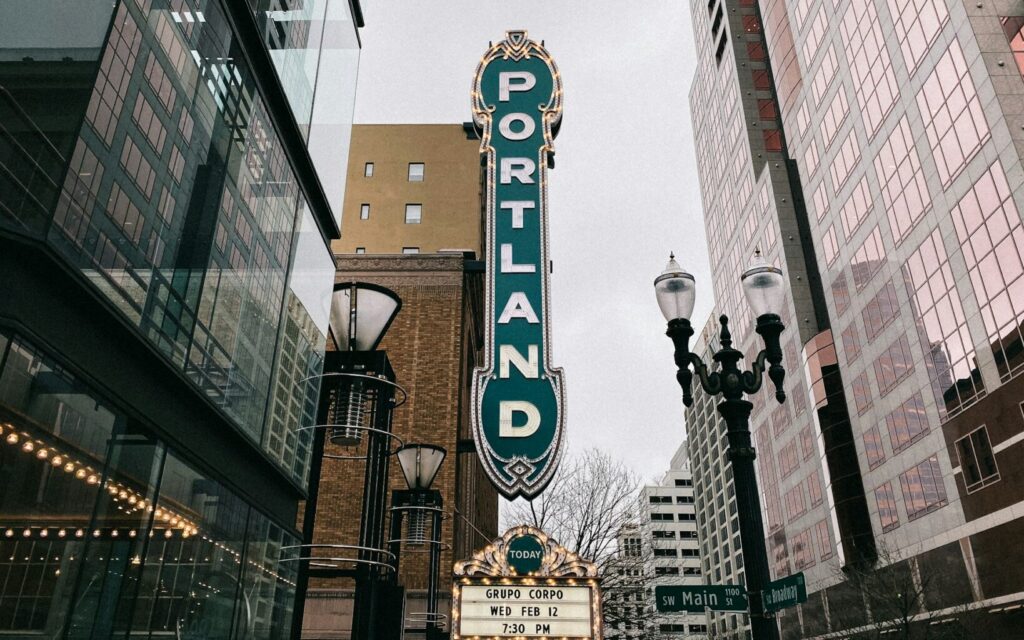 White a nd brown building with a sign that says "Portland"