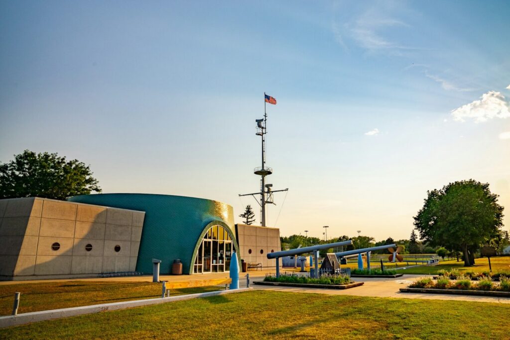 USS South Dakota Battleship Memorial building with American flag in Sioux Falls, South Dakota