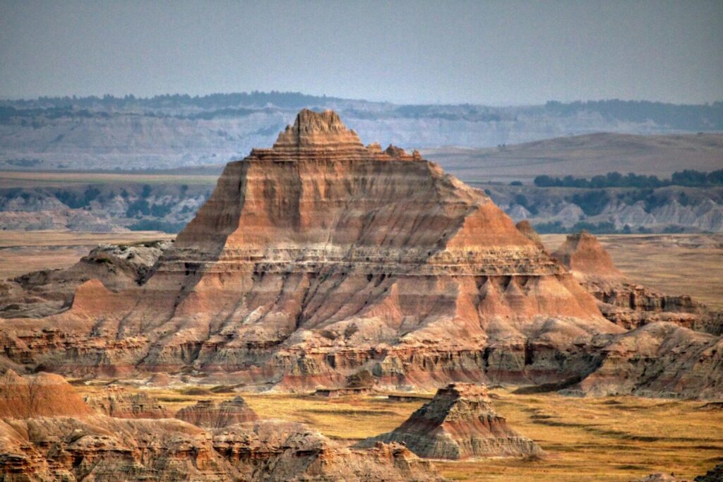 Badlands rock formations in South Dakota under a clear sky